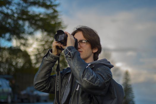 a photographer capturing nature with a camera